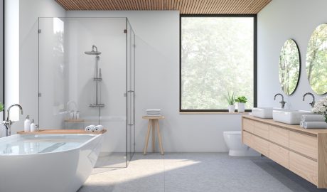 Un bany pintat en blanc amb tonalitats terroses d'altres complements